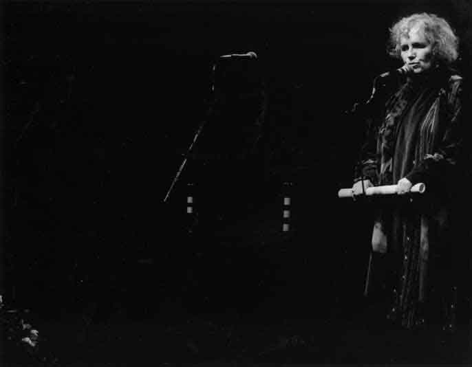 Grace at microphone