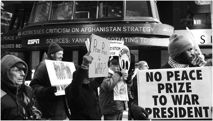 demonstrators protesting Nobel Peace Prize to Obama