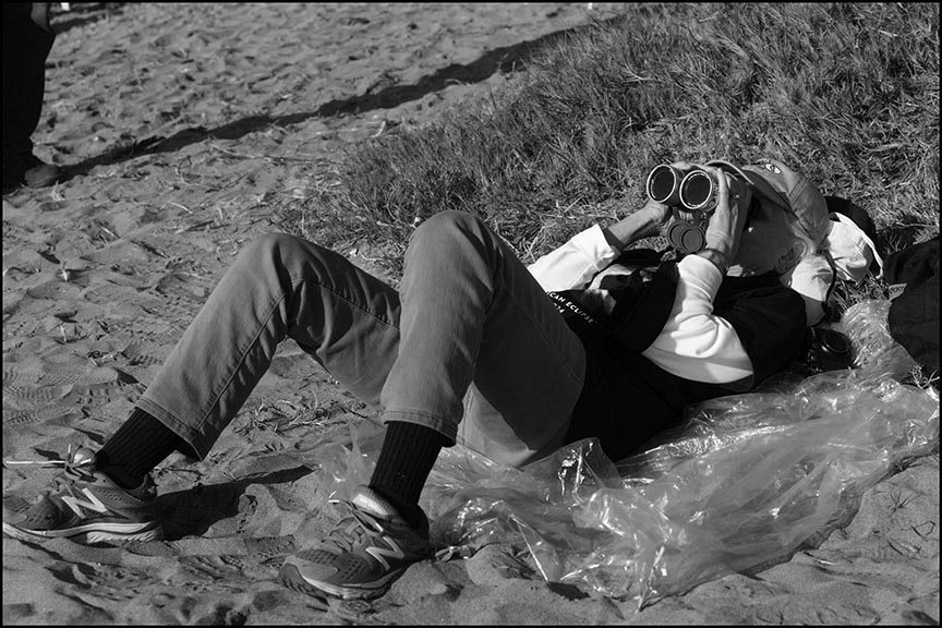 Ruth taking up an observing position on a beach dune