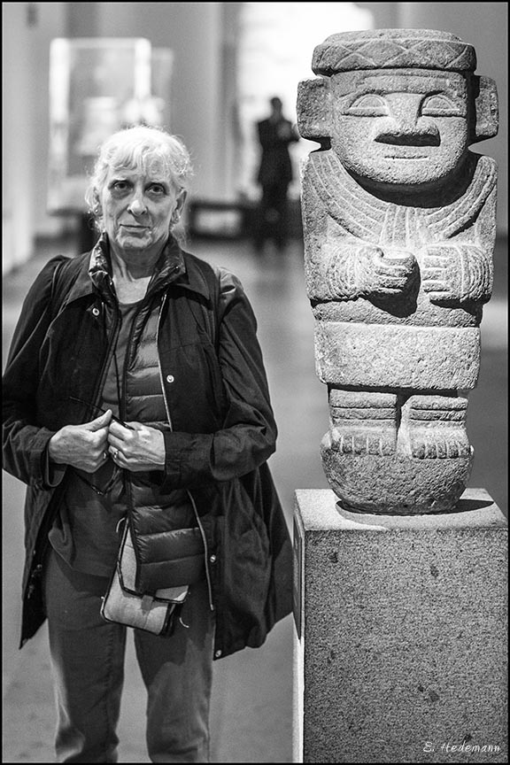 Ruth standing next to pre-Columbian sculpture