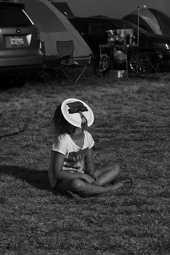 little girl with homemade solar viewer